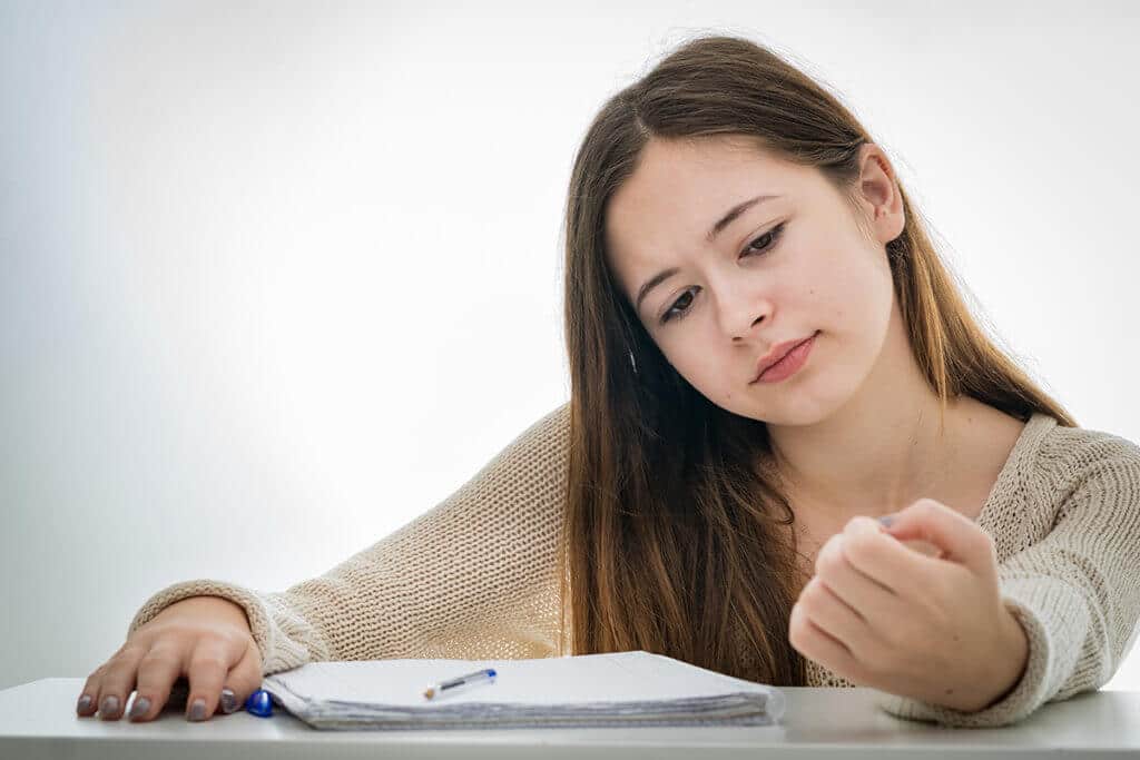 young woman focuses during therapy at ADD treatment center