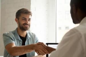 a man shakes an admissions counselors hand at a Portland Maine opiate detox center