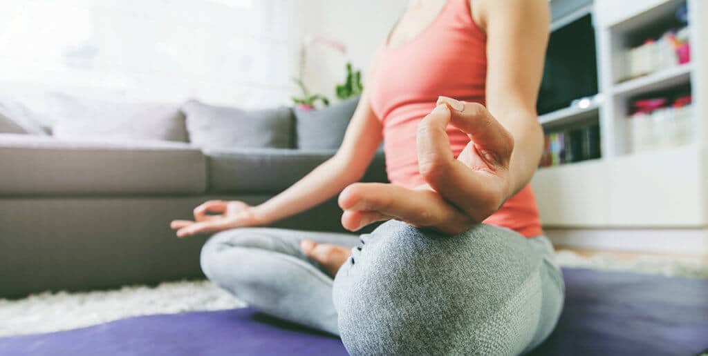 woman participating in yoga and meditation for recovery