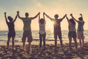 group of people attending rehab near the beach