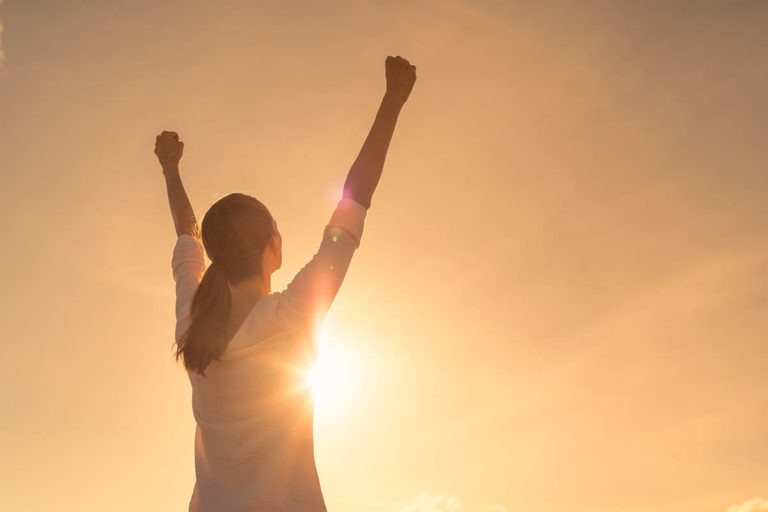 woman celebrating because she learned relapse prevention skills