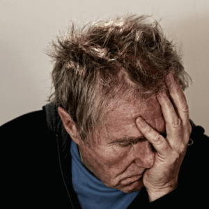 man suffering from post-acute withdrawal syndrome closeup headshot